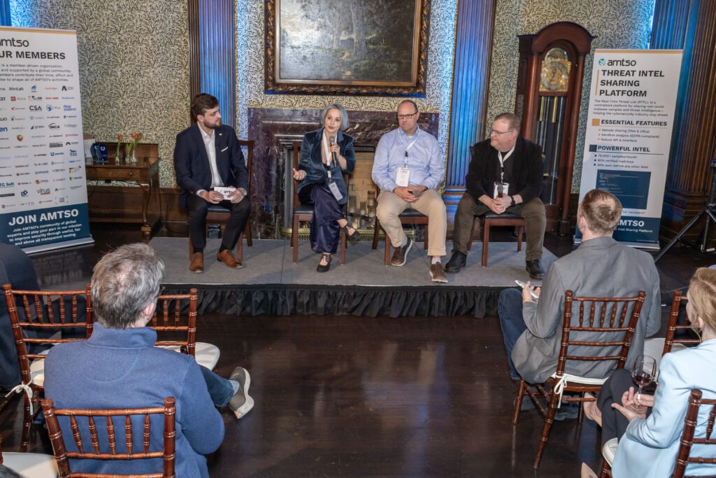 AMTSO Drink Reception during RSAC with the panel discussion with Eva Galperin (Director of Cybersecurity, Electronic Frontier Foundation), Jon Baker (Director and Co-Founder, Center for Threat-Informed Defense at MITRE), and Sam Curry (VP & CISO in Residence, Zscaler), with moderation by Vlad Iliushin, ELLIO CEO and President of AMTSO.